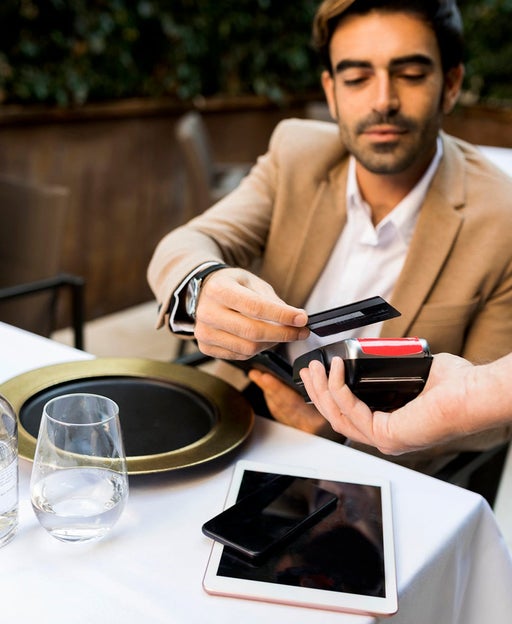 Man paying with credit card in a restaurant