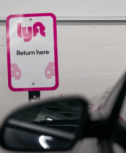 Lyft signage at a vehicle rental location in San Francisco, California, US, on Thursday, Feb. 8, 2024. Lyft Inc. is scheduled to release earnings figures on February 13. Photographer: Loren Elliott/Bloomberg